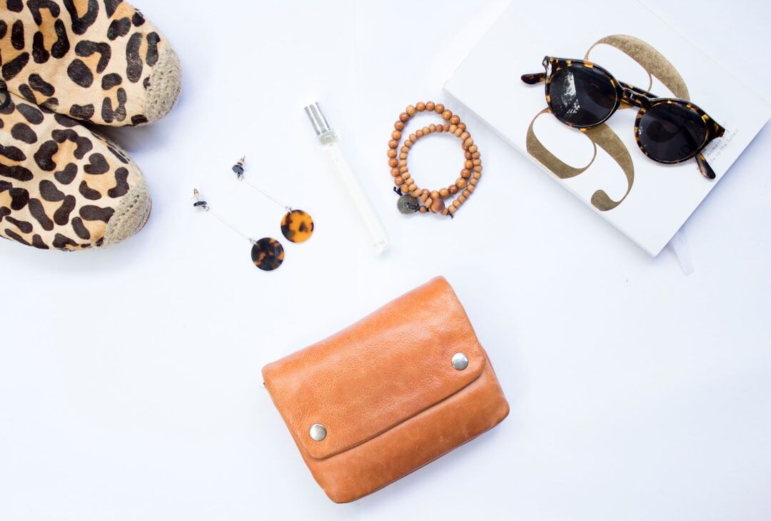 Elegant fashion editorial flatlay with designer accessories