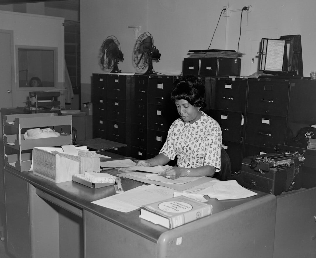 Modern magazine newsroom with editors working at desks